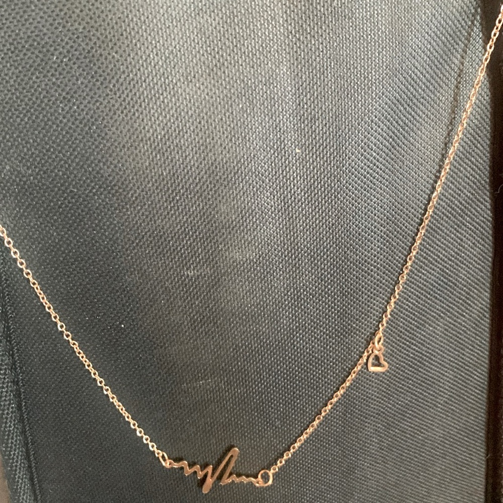 Necklace with heartbeat and heart
